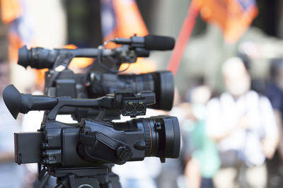 Close-up of television cameras on tripod