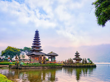 Traditional building against cloudy sky