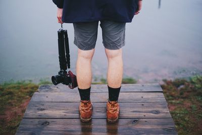 Woman walking on boardwalk