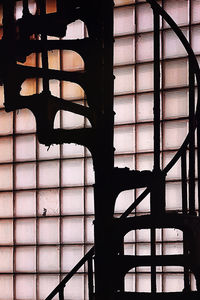 Silhouette staircase by window in building