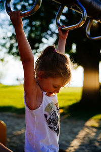 Rear view of girl holding toy