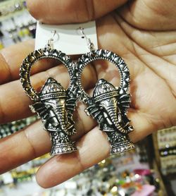 Close-up of person hand holding painting