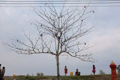 People on field against sky