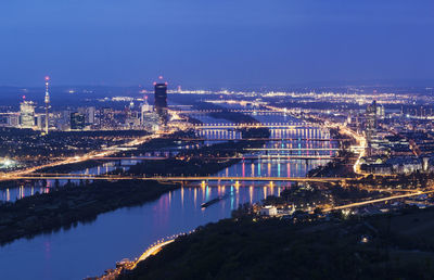 High angle view of illuminated buildings in city