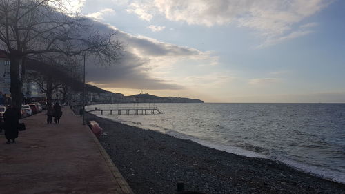 Scenic view of beach against sky during sunset