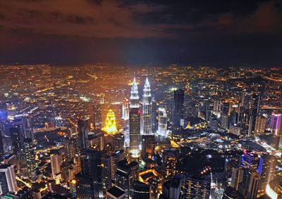 High angle view of illuminated cityscape at night