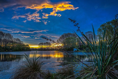 Scenic view of lake at sunset