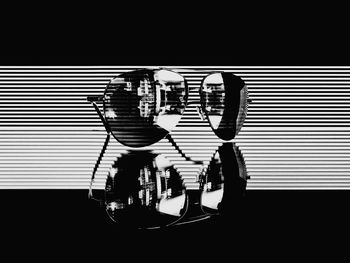 Digital composite image of light bulb against black background