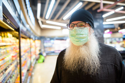 Portrait of woman wearing hat at store