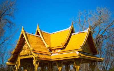 Low angle view of traditional building against blue sky