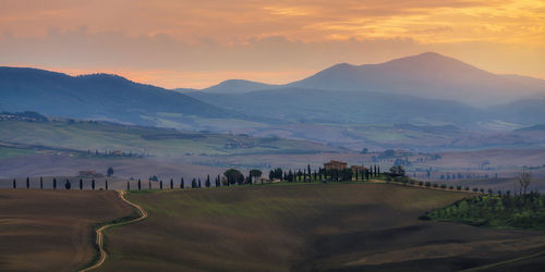 Scenic view of mountains against sky during sunset