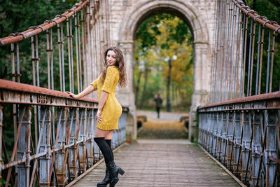 Woman standing on bridge