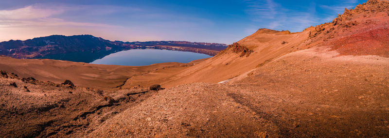 Scenic view of arid landscape against sky