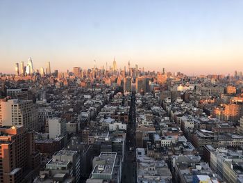 New york city skyline from manhattan rooftop sunset golden hour sunset