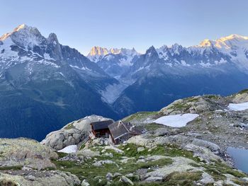 Scenic view of snowcapped mountains against clear sky