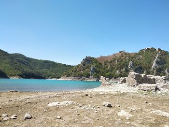 Scenic view of sea against clear blue sky