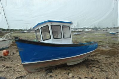 Boat moored on beach