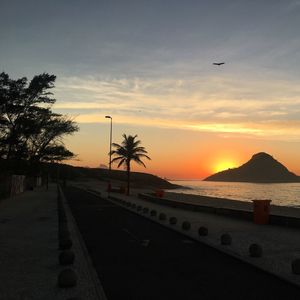 Scenic view of beach against sky during sunset