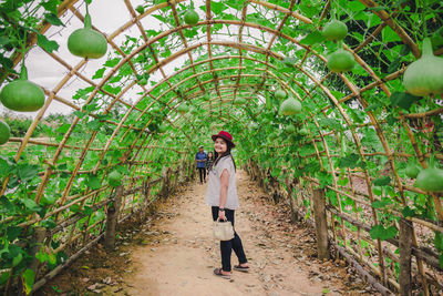 People standing by plants