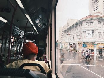 People in bus on road