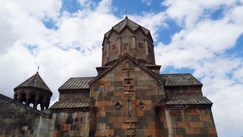 Low angle view of bell tower against sky