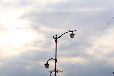 Low angle view of street light against sky