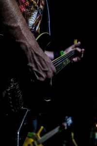 Blurred motion of man in music concert