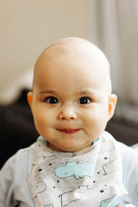 Close-up of cute baby boy at home