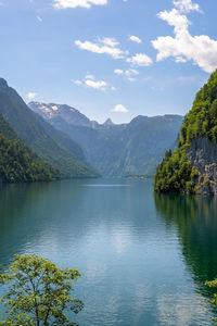 Scenic view of lake and mountains against sky