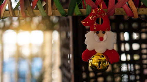 Close-up of red toy hanging at market stall