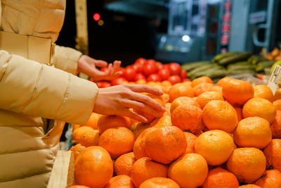 Full frame shot of orange fruits at market stall