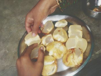 Close-up of cropped hand holding ice cream
