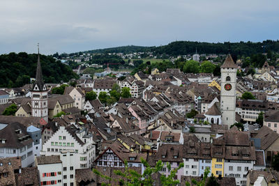 Houses in town against sky