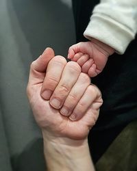 Close-up of man holding hands