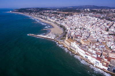 Townscape by sea against sky