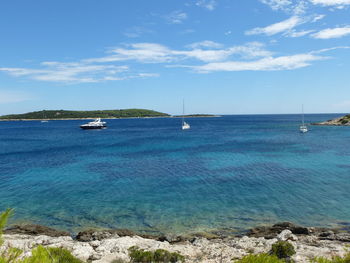 Boats sailing in sea