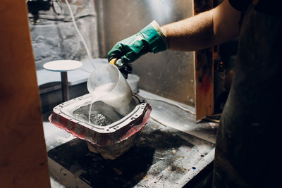 Cropped image of man working in workshop