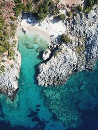 High angle view of rock formation in sea