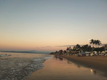 Scenic view of sea against clear sky at sunset