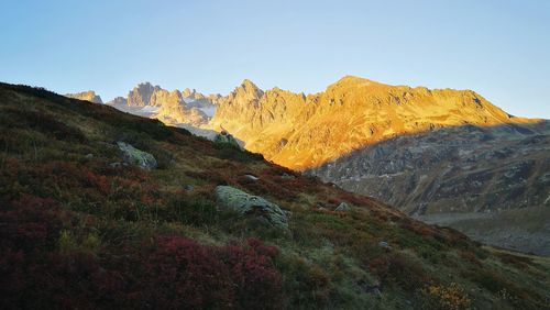 Scenic view of rocky mountains against clear sky