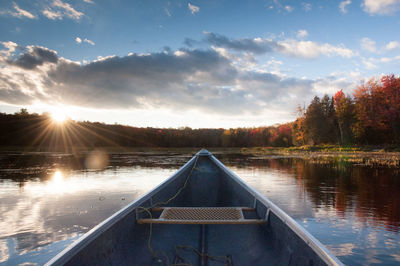 Scenic view of river at sunset