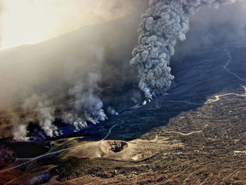 Smoke emitting from volcanic mountain