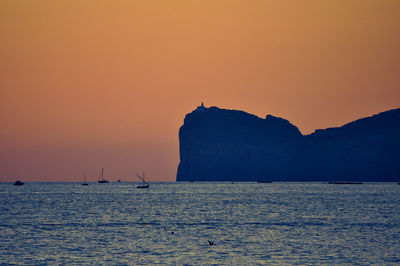 Scenic view of sea against sky at sunset