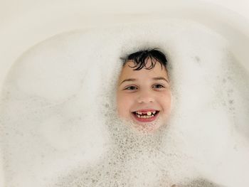 High angle view of young woman in bathtub