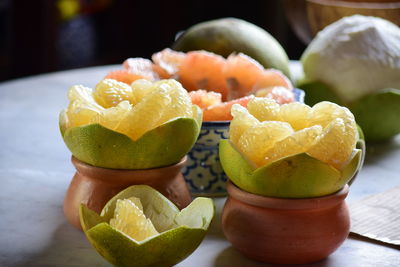 Close-up of fruits in plate on table