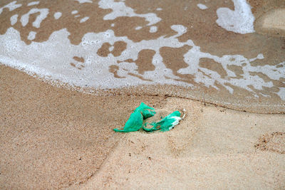 High angle view of toy on sand