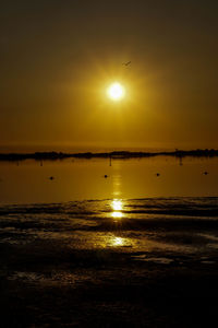 Scenic view of lake at sunset