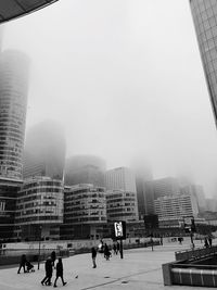 Buildings in city against clear sky