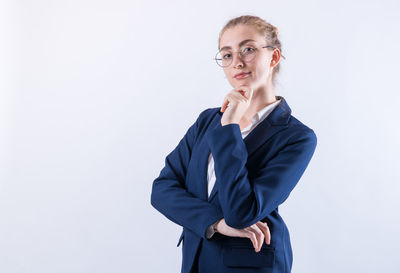 Portrait of a serious young woman over white background