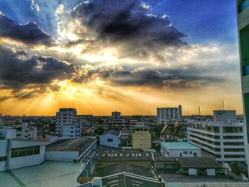 Cityscape against sky during sunset